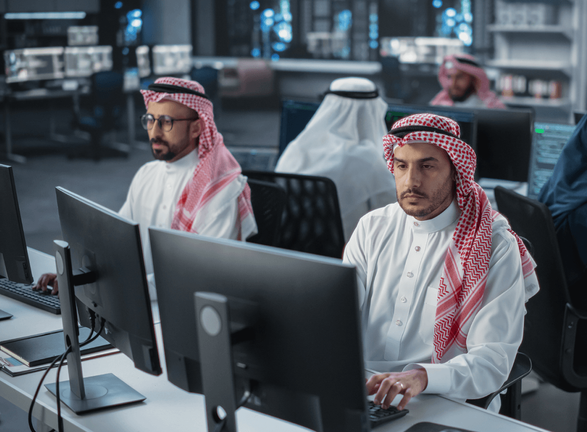 Saudi Arabian man working at a computer