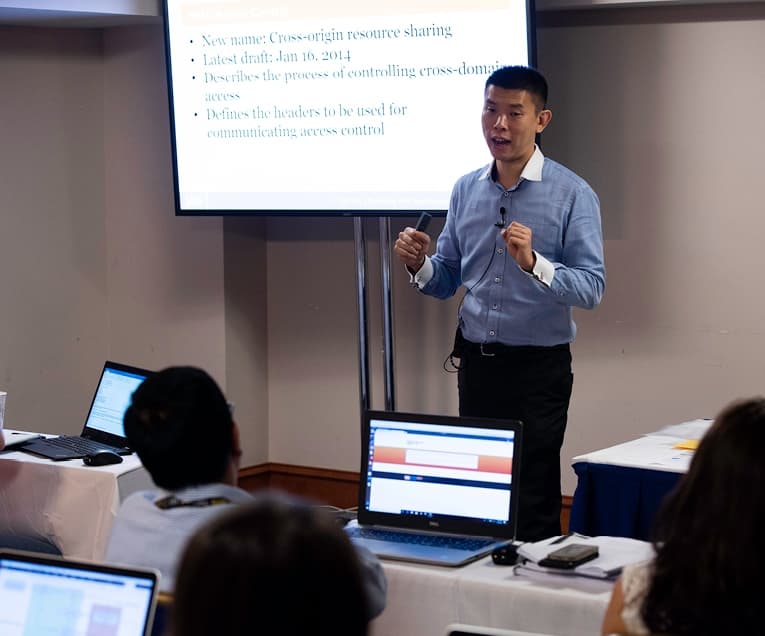 Jason Lam: Teacher Talking in Front of a Classroom