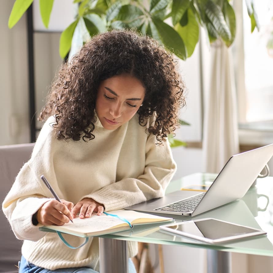 Woman Writing and At Laptop