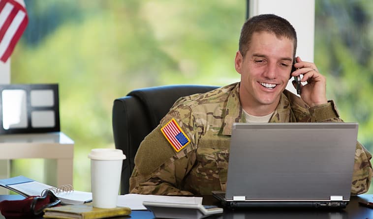 Soldier working on laptop