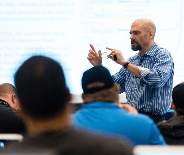 Students listening to a teacher speak