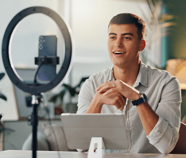 Smiling man talking into microphone