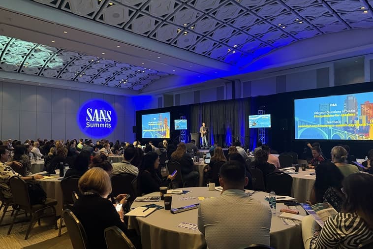 SANS Security Awareness Summit 2025, People Looking At A Stage