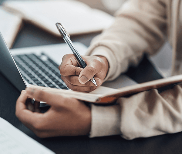 Person Writing in Journal