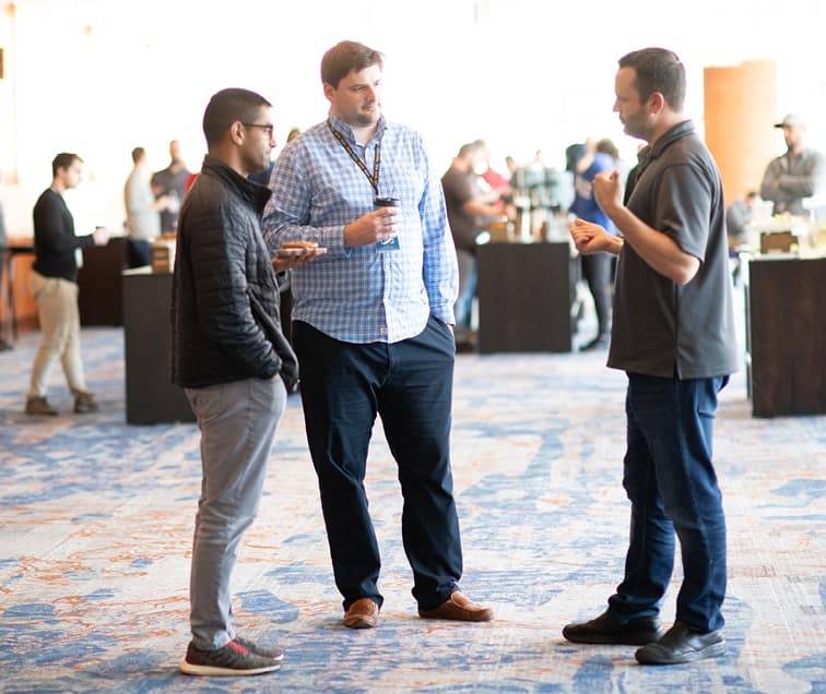 Men Talking While Enjoying Coffee
