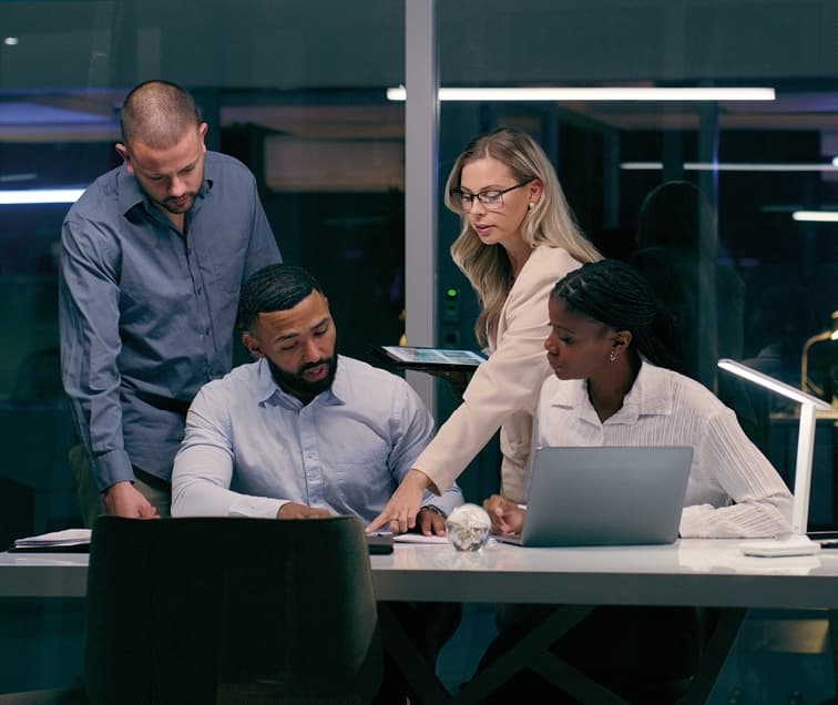 People Gathered Around a Desk and Working