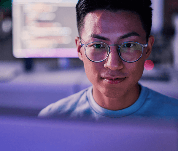 Person smiling at keyboard