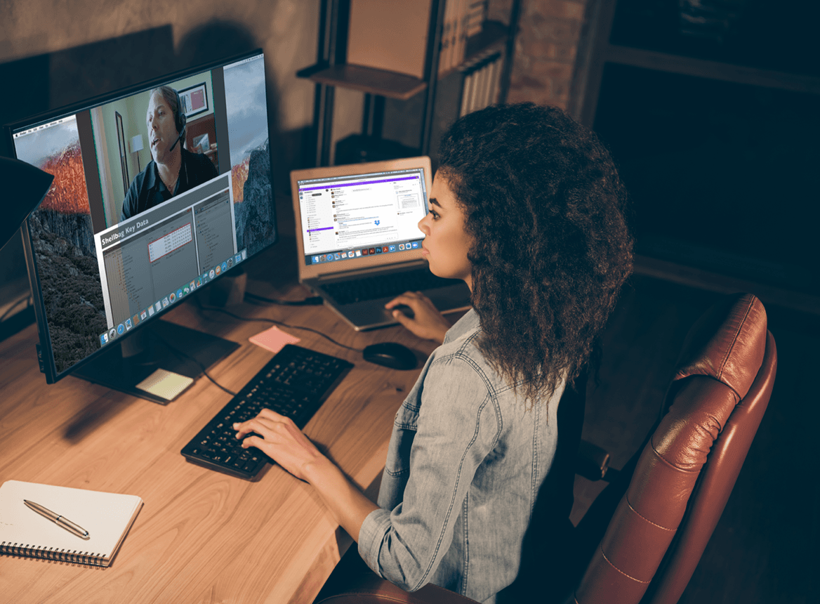 Woman at Desk at Home Listening to an Ondemand Course