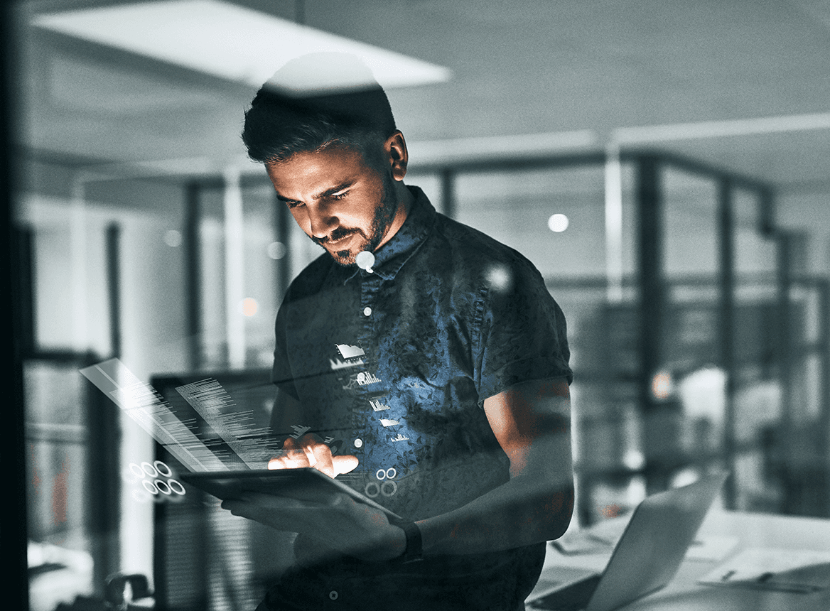 Man Using Tablet While Icons Hover in the Air