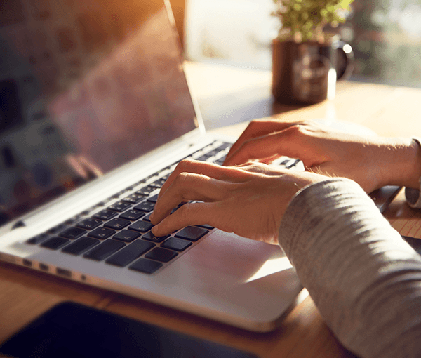 Person typing on a laptop