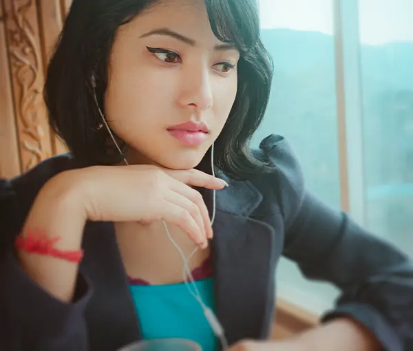 Woman watching webcast on screen