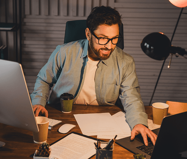 Man presenting webcast to laptop screen