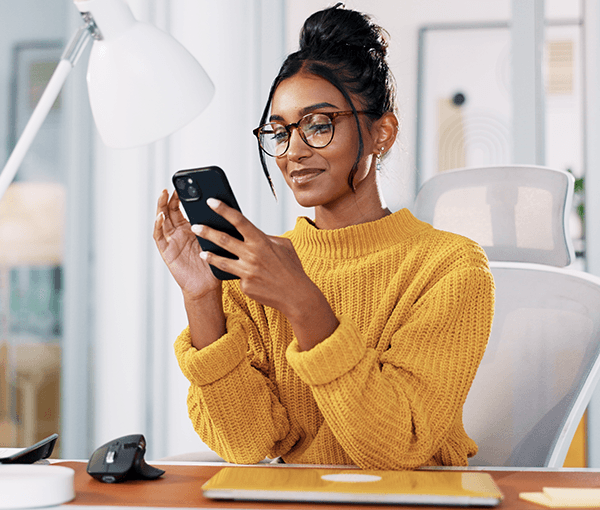 Person looking at her phone and reading a SANS blog